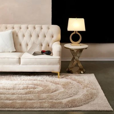 Denna produkten heter Moody Bow, tillverkad av Polyester material med en vacker Beige färg - SE Mattor
