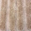 Denna produkten heter Moody Bow, tillverkad av Polyester material med en vacker Beige färg - SE Mattor