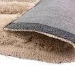 Denna produkten heter Moody Bow, tillverkad av Polyester material med en vacker Beige färg - SE Mattor