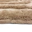 Denna produkten heter Moody Bow, tillverkad av Polyester material med en vacker Beige färg - SE Mattor