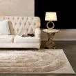 Denna produkten heter Moody Bow, tillverkad av Polyester material med en vacker Beige färg - SE Mattor