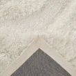 Denna produkten heter Moody Bow, tillverkad av Polyester material med en vacker Vit färg - SE Mattor