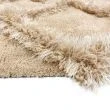 Denna produkten heter Moody Flo, tillverkad av Polyester material med en vacker Beige färg - SE Mattor