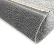 Denna produkten heter Reno Daphne, tillverkad av Polyester material med en vacker Grå färg - SE Mattor
