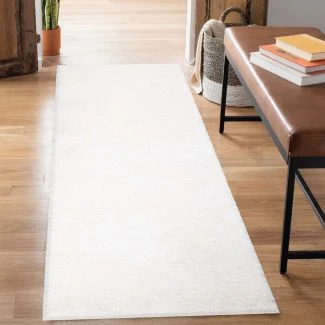 Denna produkten heter Lazy, tillverkad av Polypropylen material med en vacker Offwhite färg - SE Mattor