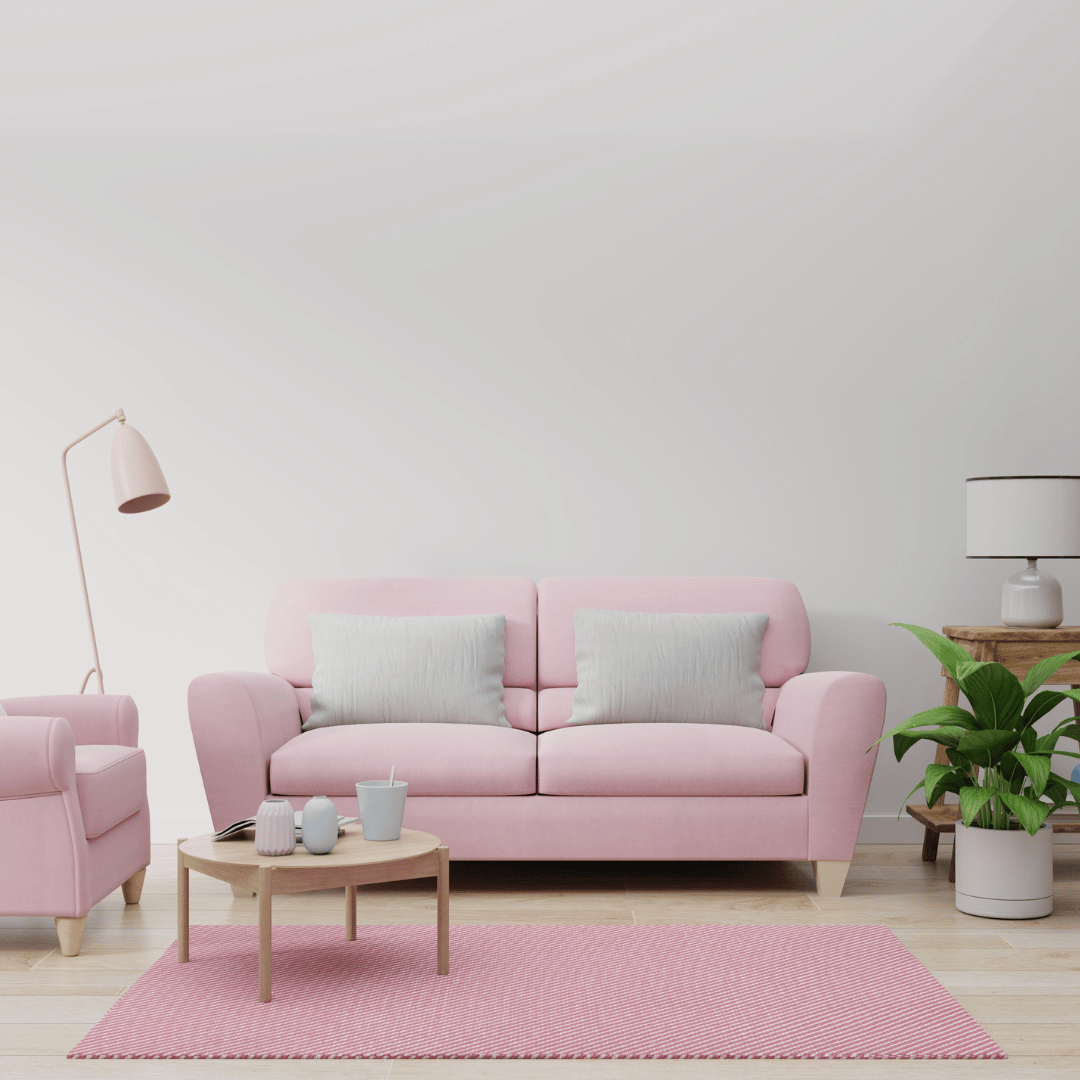 Rosa soffa med rosa matta under i unik och vacker inredning i vardagsrum.