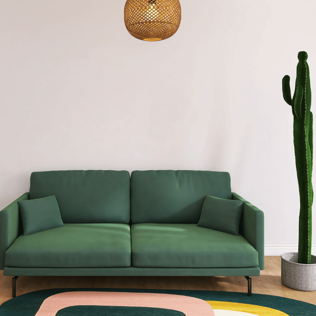 Grön soffa med färgglad matta under som skapar en djärv och unik inredning.